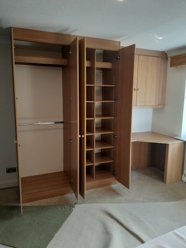 Pair of in-built wardrobes with custom-designed interior areas.